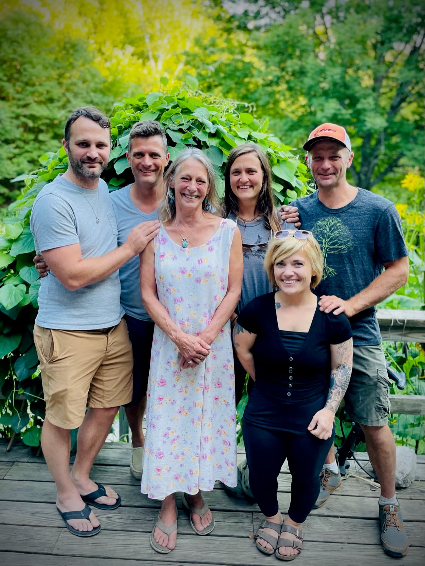 Aletta with her five grown children gathered on the deck in front of the gardens